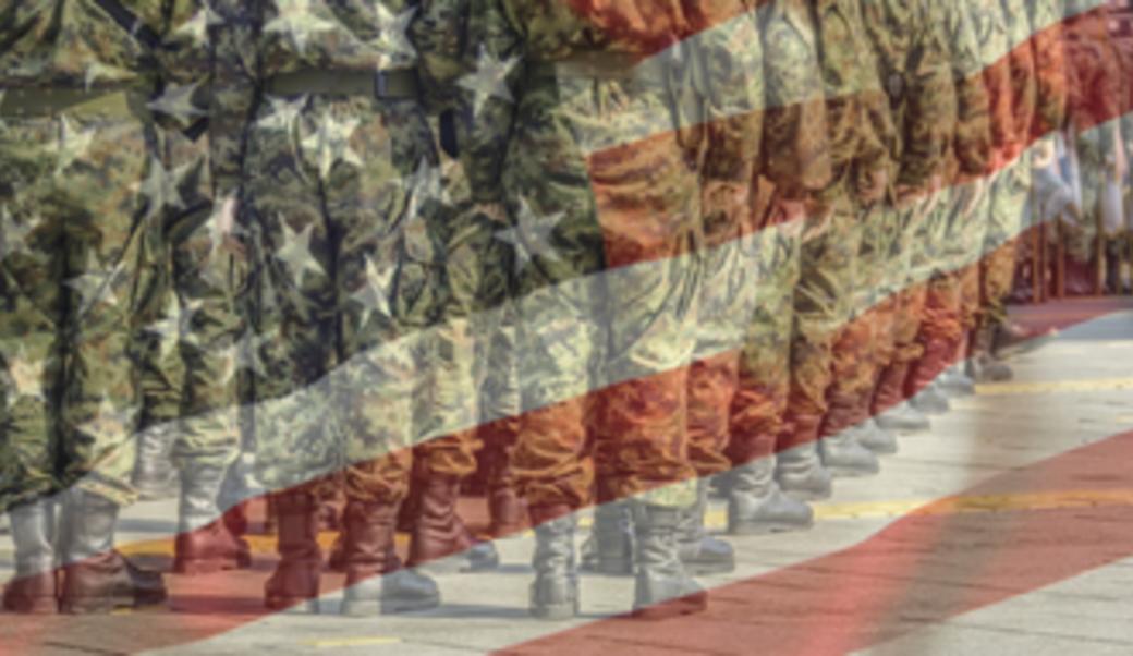 American flag superimposed with image of soldiers