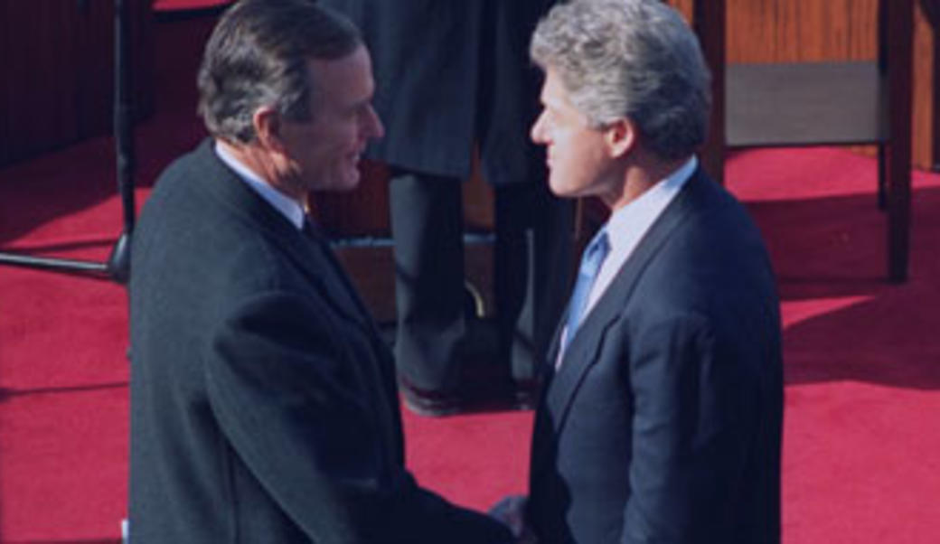George H. W. Bush and Bill Clinton shake hands at Clinton's 1993 inauguration