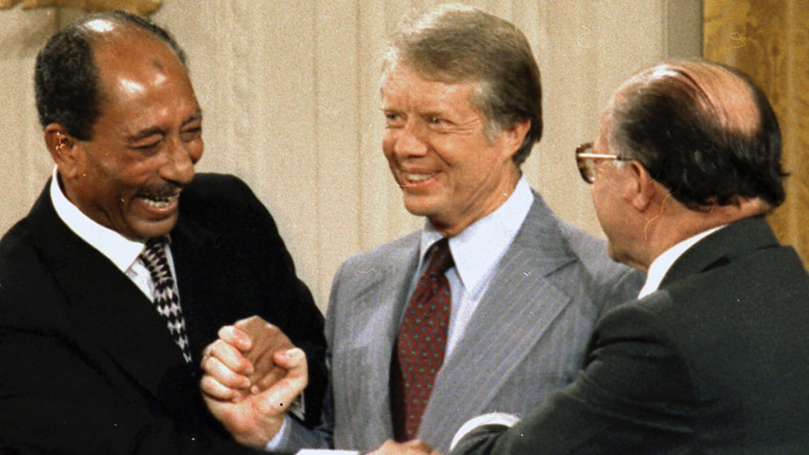 Anwar Sadat, President Carter, and Menachem Begin sign Camp David Accords
